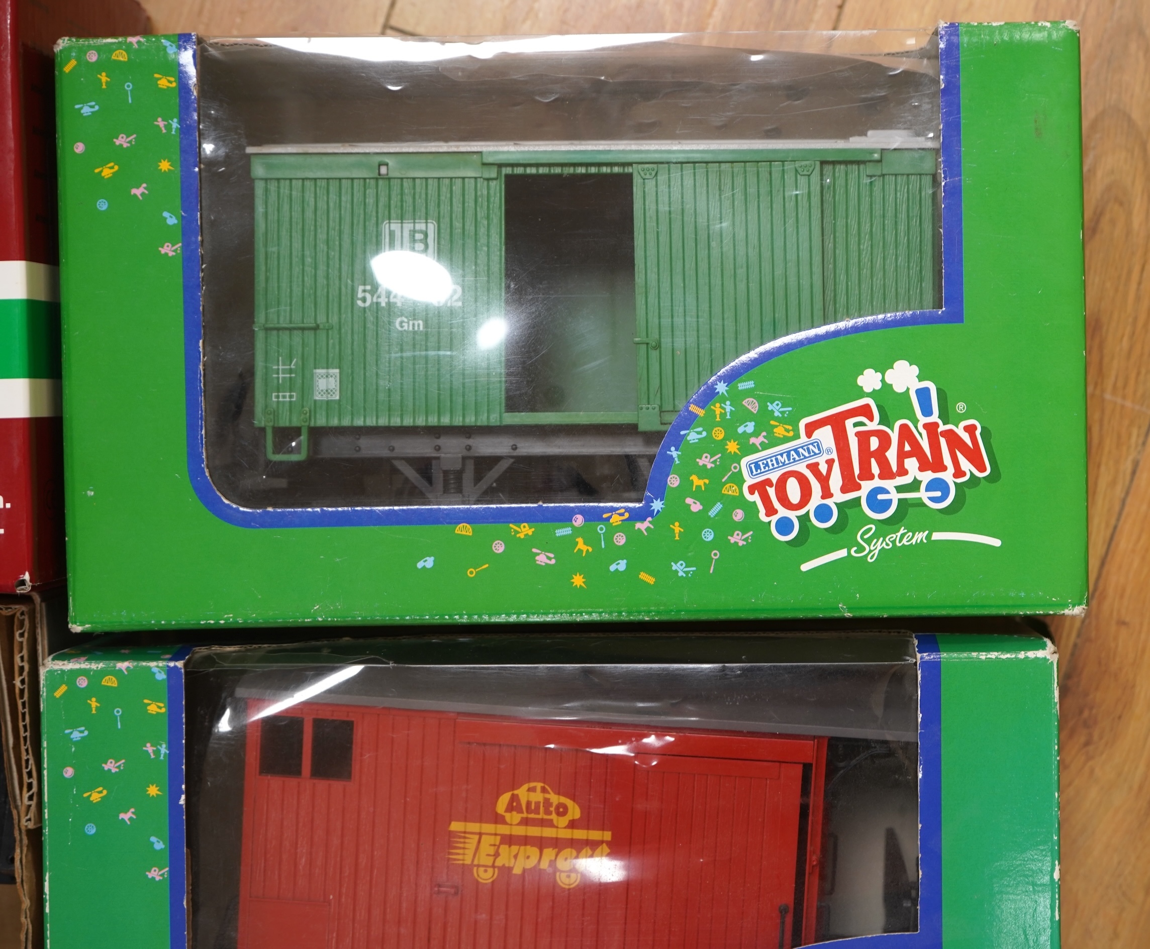 Four Lehmann and Bachmann G scale (45mm gauge) freight wagons; an unconstructed Bachmann Big Haulers G Kits 4-door Baggage Car (98910), an LGB 4-wheel coach in associated box, plus two others by Lehmann Toytrain in assoc
